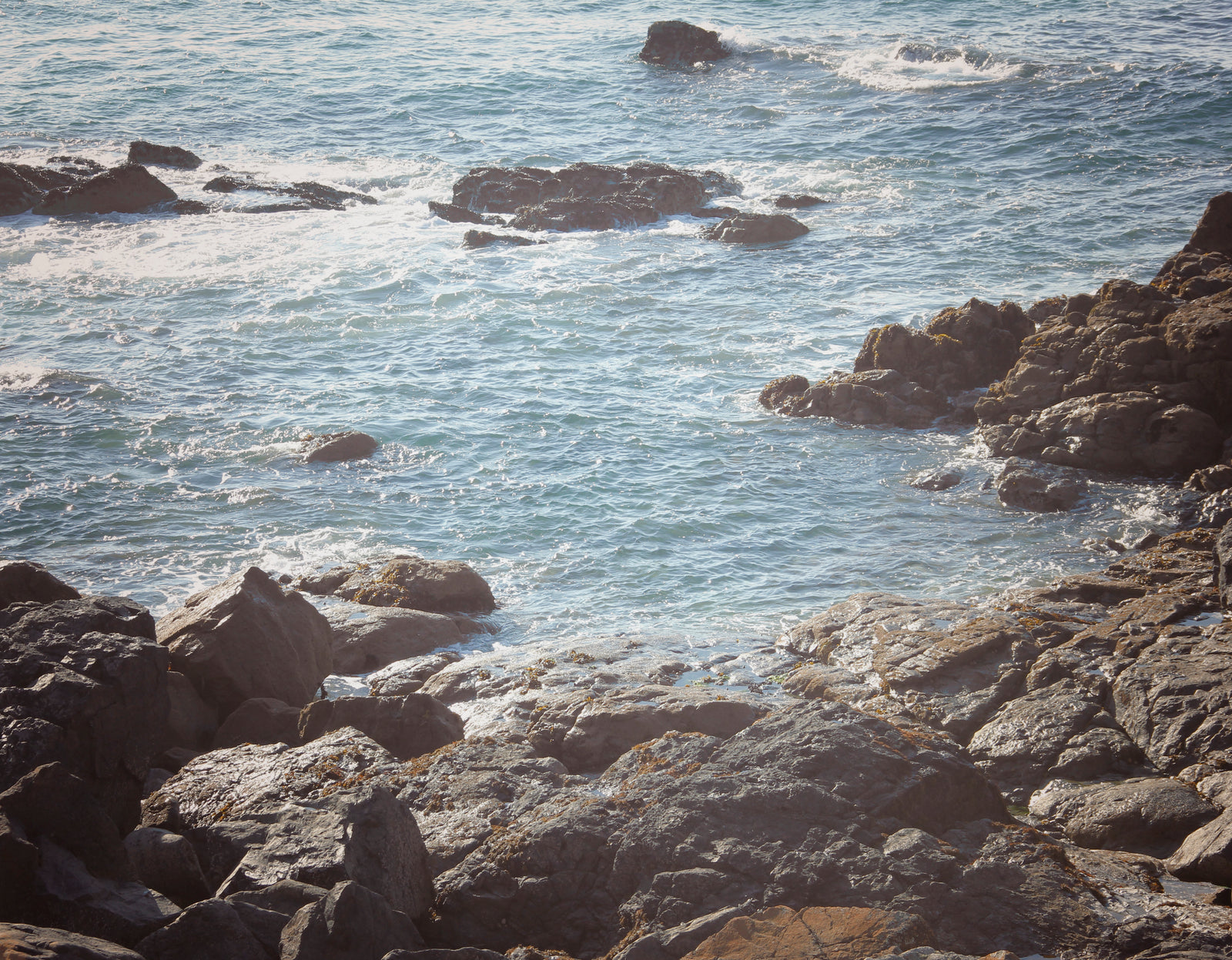 Warm, coastal waters and rocks under The Island, St. Ives